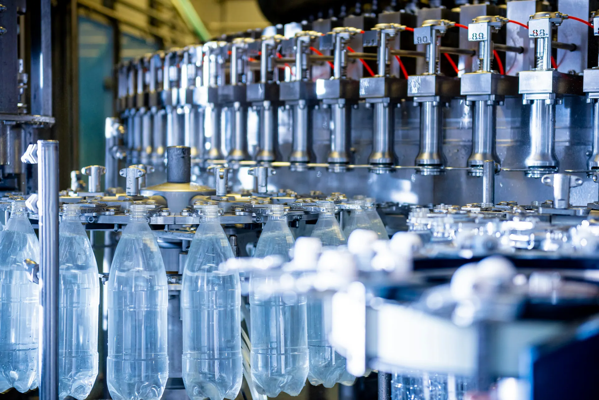 Mineral water bottles moving through a bottling line